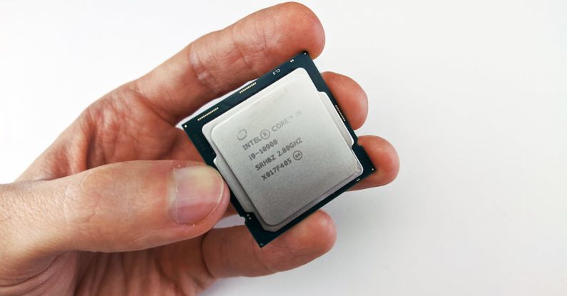Computer Specs - Person Holding an Intel Processor