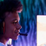 Gamer Profile - Boy in Front of Computer with Black Headphones