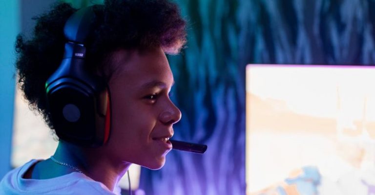 Gamer Profile - Boy in Front of Computer with Black Headphones