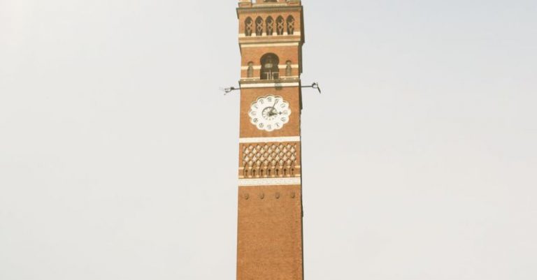 Indie Games - A tall clock tower with a clock on it