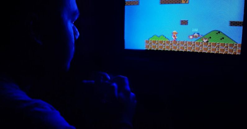 Classic Games - Photo of Man Playing Super Mario Bros