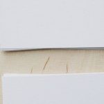 Mod Promotion - Top view of stacks of white mockup greeting cards placed on light wooden desk in soft daylight