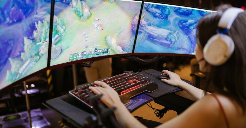 Gaming Monitors - A Woman Playing League of Legends